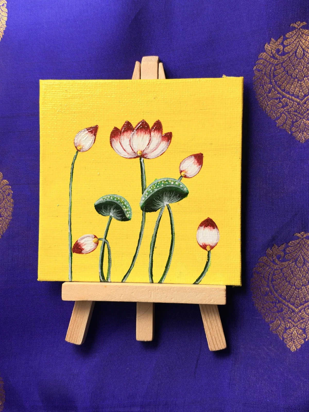 Lotus painting on a miniature easel